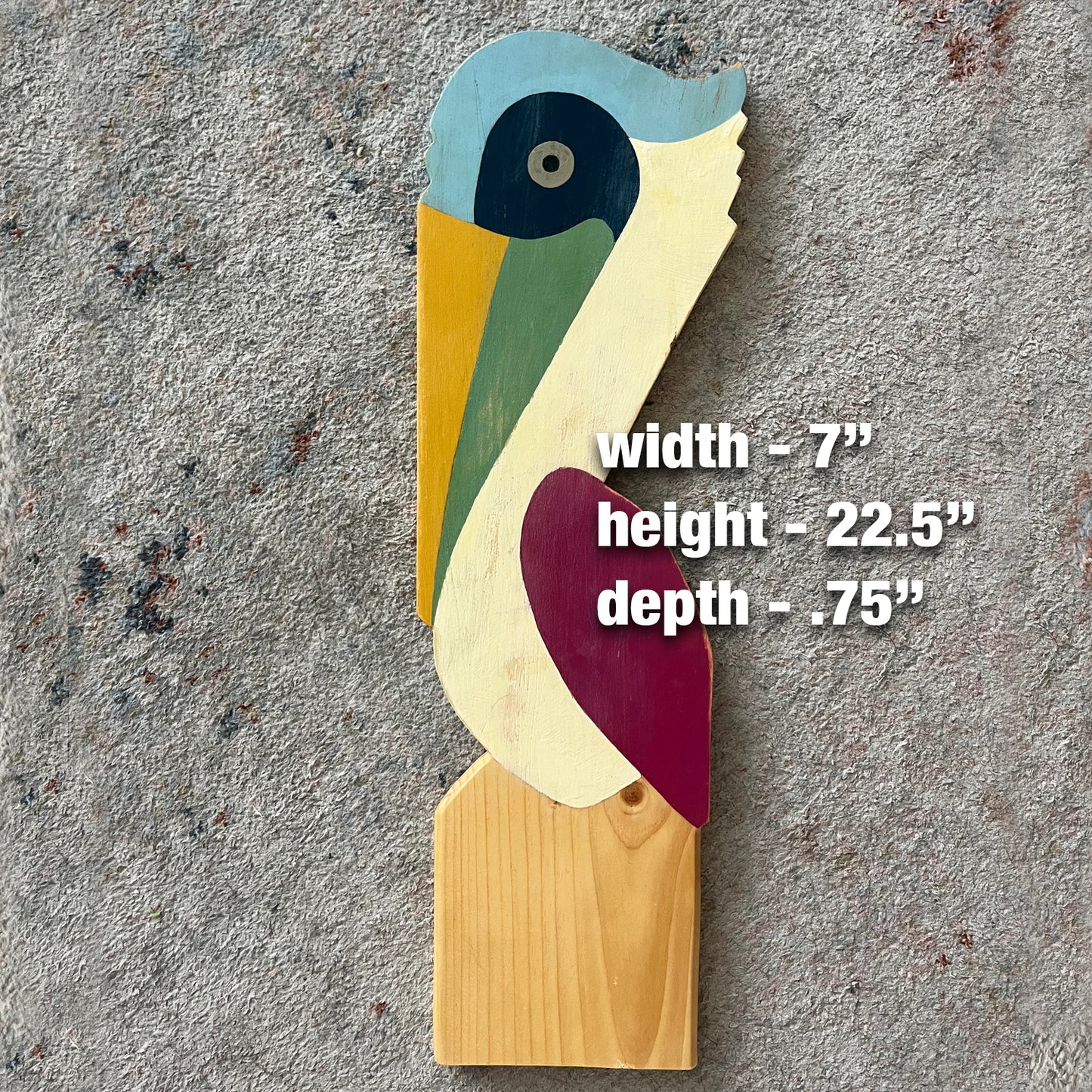 Small Pelican On A Post